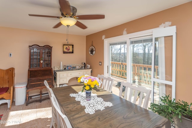 dining room with light tile patterned floors and ceiling fan