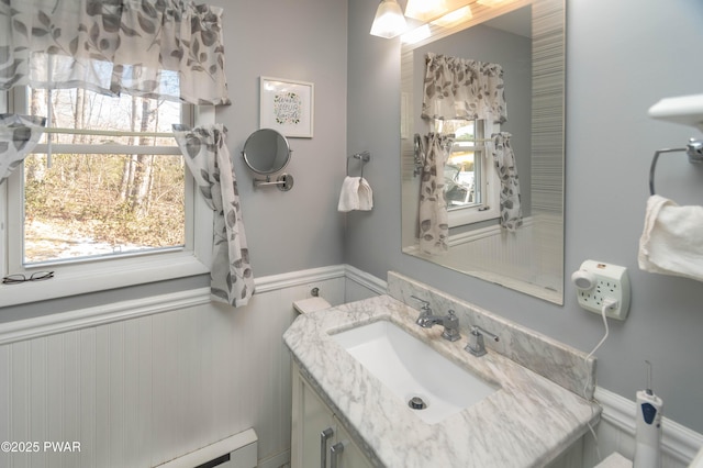 bathroom with vanity and a baseboard heating unit