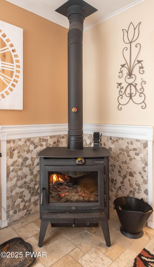 details featuring crown molding and a wood stove