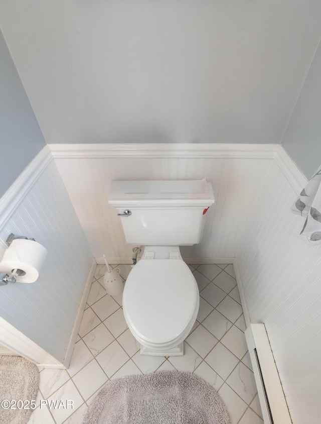 bathroom with a baseboard heating unit and toilet