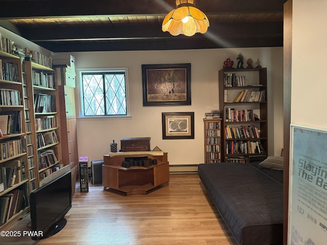 219 Woodpecker Ct, Bushkill, PA 18324 - living area with wood finished floors, a baseboard heating unit, and a wood ceiling with exposed beams