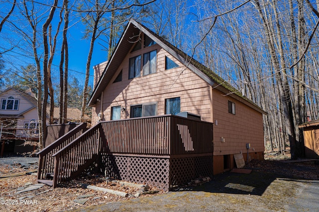 back of property featuring a deck