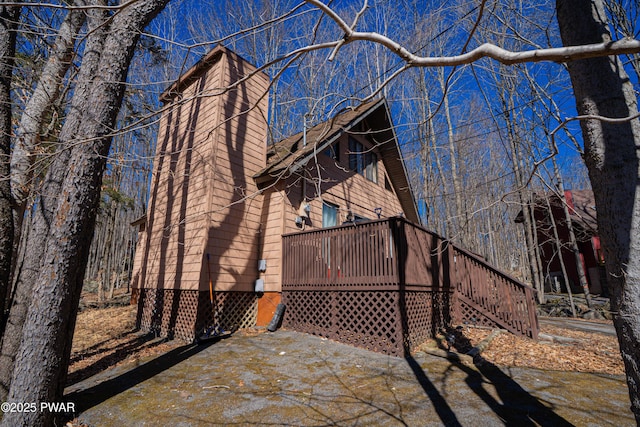 exterior space featuring a wooden deck