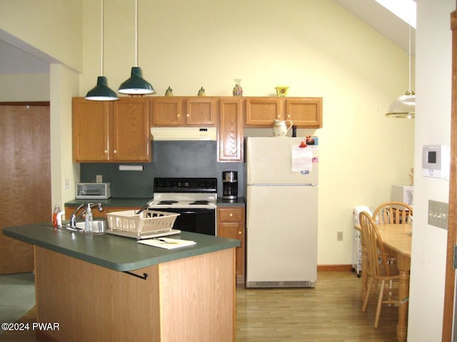 kitchen featuring white appliances, backsplash, sink, vaulted ceiling, and light hardwood / wood-style flooring