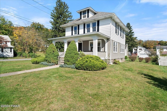 view of front of house featuring a porch and a front yard