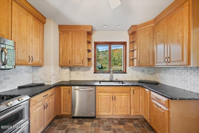 kitchen featuring tasteful backsplash, sink, and appliances with stainless steel finishes