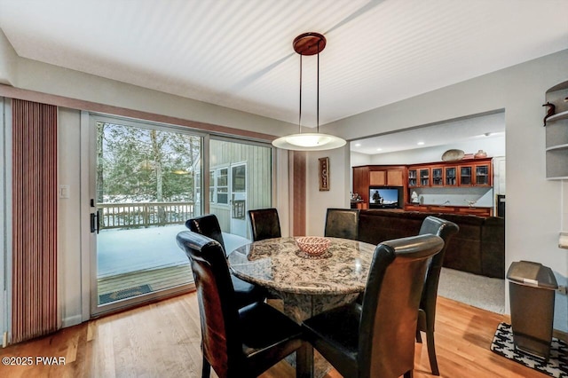 dining space with light wood-type flooring