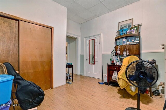 hallway with light hardwood / wood-style flooring