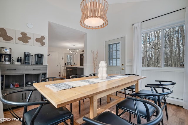 dining space with light wood-type flooring