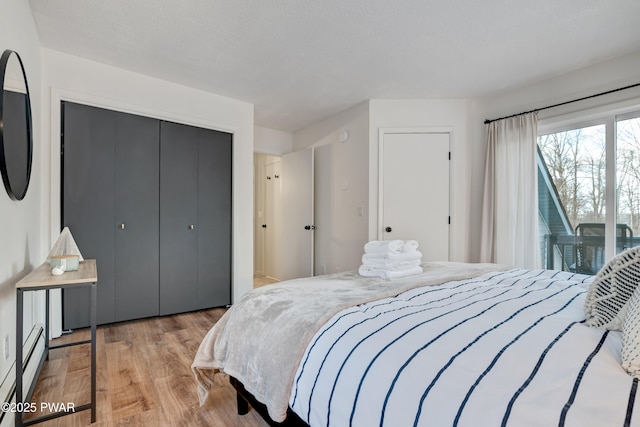 bedroom with a closet and light wood-type flooring