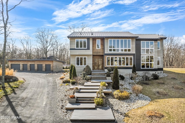 122 Overlook Ln, Lords Valley, PA 18428 - view of front of house with an outdoor structure, a garage, a standing seam roof, and metal roof