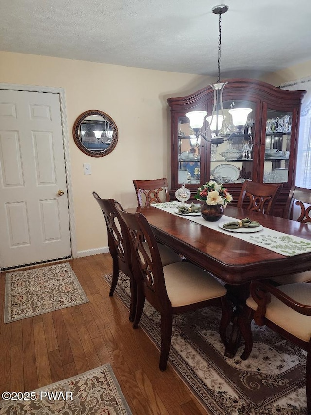 814 Clearview Dr, Long Pond, PA 18334 - dining space featuring baseboards, a notable chandelier, and hardwood / wood-style flooring