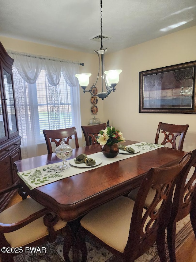 814 Clearview Dr, Long Pond, PA 18334 - dining area featuring visible vents, wood finished floors, and an inviting chandelier