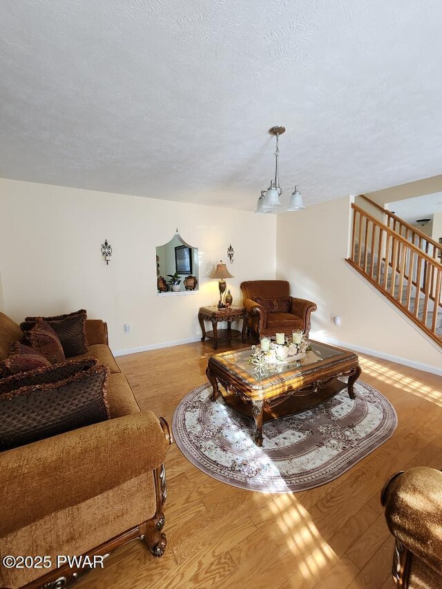 814 Clearview Dr, Long Pond, PA 18334 - living room featuring stairs, baseboards, and wood finished floors