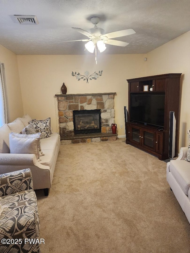 814 Clearview Dr, Long Pond, PA 18334 - living area featuring visible vents, carpet floors, a fireplace, ceiling fan, and a textured ceiling