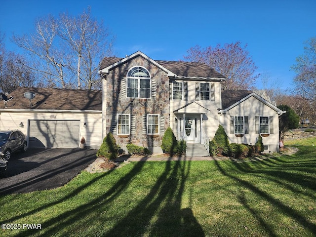 814 Clearview Dr, Long Pond, PA 18334 - view of front of home featuring stone siding, an attached garage, a front yard, and aphalt driveway