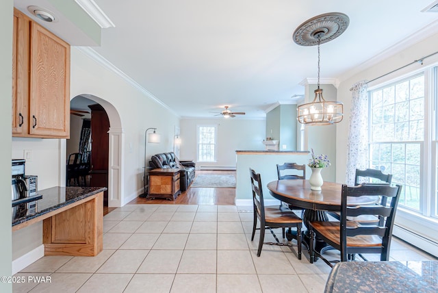 302 Oneida Way, Milford, PA 18337 - dining area with ornamental molding, ceiling fan, arched walkways, light tile patterned floors, and baseboards