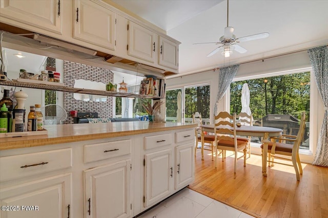 115 Washington Dr, Lords Valley, PA 18428 - kitchen featuring ceiling fan, light countertops, white cabinets, and light marble finish flooring