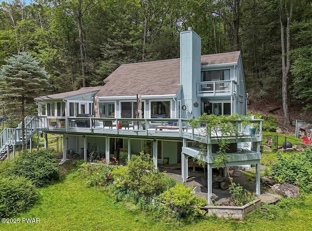 115 Washington Dr, Lords Valley, PA 18428 - rear view of house featuring a balcony, stairs, a chimney, and a deck