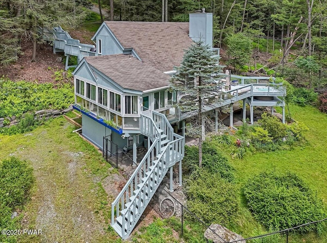 115 Washington Dr, Lords Valley, PA 18428 - back of house featuring a shingled roof, stairway, a chimney, a wooden deck, and a sunroom