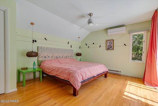 115 Washington Dr, Lords Valley, PA 18428 - bedroom with a baseboard heating unit, a wall unit AC, light wood-type flooring, lofted ceiling, and ceiling fan