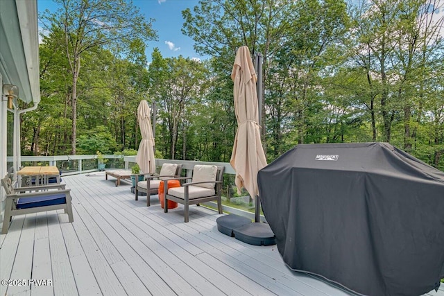 115 Washington Dr, Lords Valley, PA 18428 - deck with grilling area, an outdoor hangout area, and view of wooded area