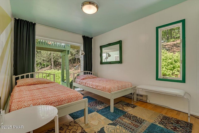 115 Washington Dr, Lords Valley, PA 18428 - bedroom with wood finished floors and a baseboard radiator