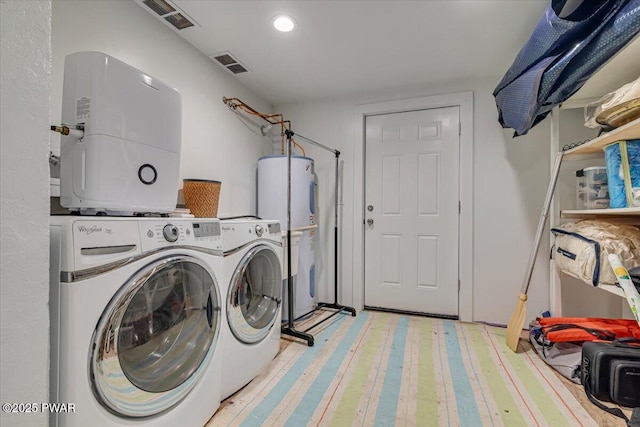 115 Washington Dr, Lords Valley, PA 18428 - laundry area featuring water heater, washing machine and clothes dryer, and recessed lighting