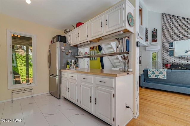 115 Washington Dr, Lords Valley, PA 18428 - kitchen featuring white cabinetry, plenty of natural light, and freestanding refrigerator