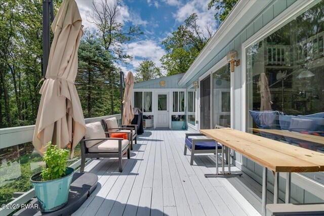 115 Washington Dr, Lords Valley, PA 18428 - wooden terrace with a sunroom and an outdoor living space