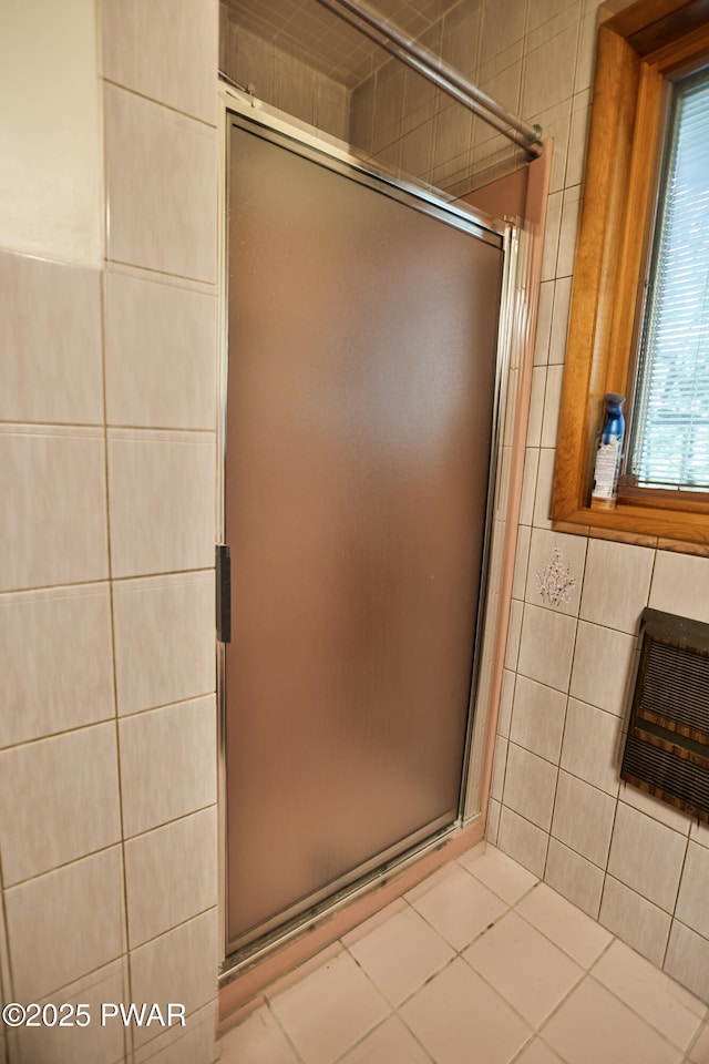 216 Canterbrook Dr, Lords Valley, PA 18328 - bathroom featuring tile walls, a stall shower, and heating unit