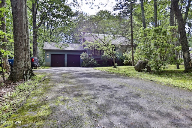 216 Canterbrook Dr, Lords Valley, PA 18328 - view of front of property with a garage and driveway