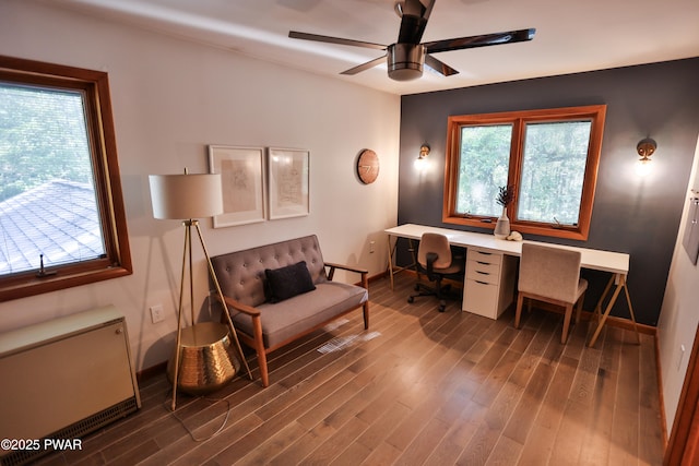 216 Canterbrook Dr, Lords Valley, PA 18328 - office area featuring dark wood-type flooring, ceiling fan, and radiator heating unit