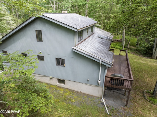 216 Canterbrook Dr, Lords Valley, PA 18328 - back of house featuring a shingled roof, a wooden deck, and a forest view