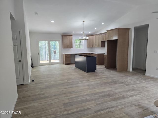 72 Lakeview Dr, Lake Ariel, PA 18436 - kitchen with a chandelier, a kitchen island, lofted ceiling, recessed lighting, and open floor plan