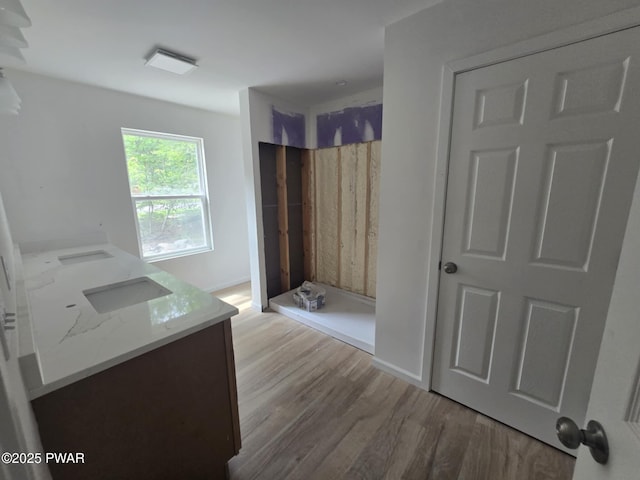 72 Lakeview Dr, Lake Ariel, PA 18436 - full bathroom with double vanity, wood finished floors, and a walk in shower