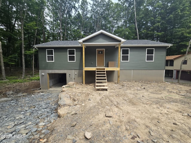 72 Lakeview Dr, Lake Ariel, PA 18436 - view of front facade featuring a garage, stairs, a shingled roof, and view of wooded area