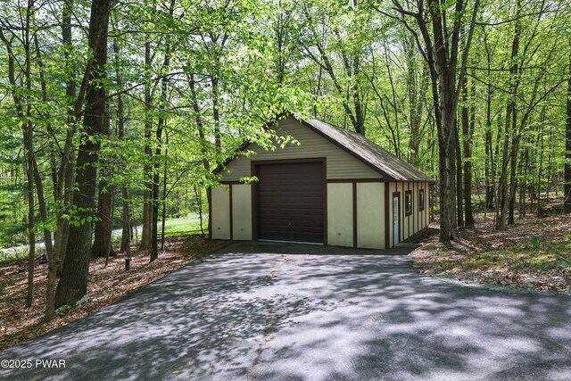 2766 Owego Tpke, Hawley, PA 18428 - detached garage featuring driveway and a wooded view
