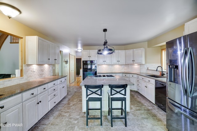 2766 Owego Tpke, Hawley, PA 18428 - kitchen with black appliances, a sink, decorative backsplash, and light stone countertops