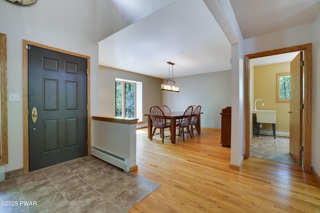 2766 Owego Tpke, Hawley, PA 18428 - entryway with baseboard heating, plenty of natural light, and light wood finished floors