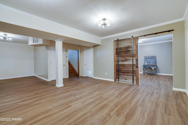 2766 Owego Tpke, Hawley, PA 18428 - finished basement featuring a barn door, ornamental molding, light wood-style floors, stairway, and baseboards