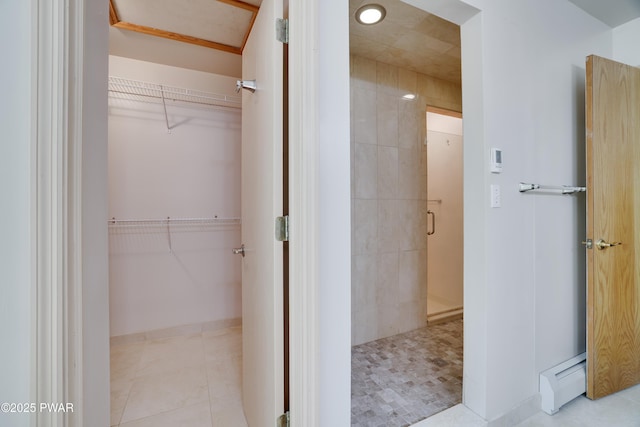 2766 Owego Tpke, Hawley, PA 18428 - bathroom with a stall shower, a walk in closet, a baseboard radiator, tile patterned floors, and recessed lighting