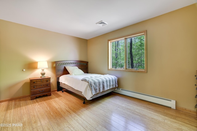 2766 Owego Tpke, Hawley, PA 18428 - bedroom with baseboard heating and wood-type flooring