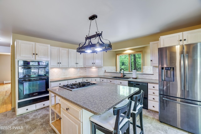 2766 Owego Tpke, Hawley, PA 18428 - kitchen featuring black appliances, a sink, a kitchen island, backsplash, and a breakfast bar