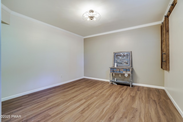 2766 Owego Tpke, Hawley, PA 18428 - unfurnished room with crown molding, wood finished floors, baseboards, and a barn door
