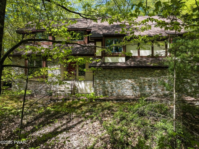 2766 Owego Tpke, Hawley, PA 18428 - rear view of house with roof with shingles, stone siding, and stucco siding