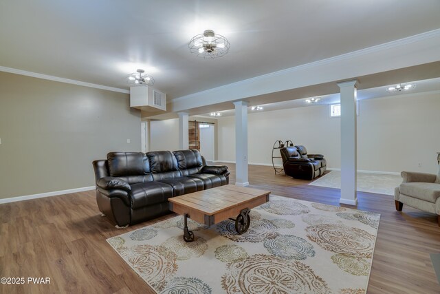2766 Owego Tpke, Hawley, PA 18428 - living area with ornate columns, wood finished floors, ornamental molding, and baseboards