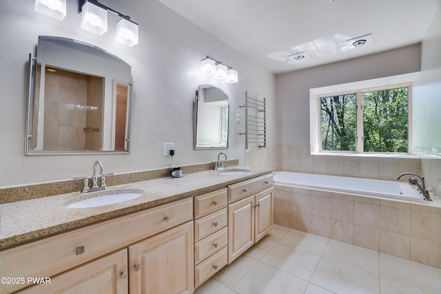 2766 Owego Tpke, Hawley, PA 18428 - bathroom featuring tile patterned flooring, a garden tub, and double vanity