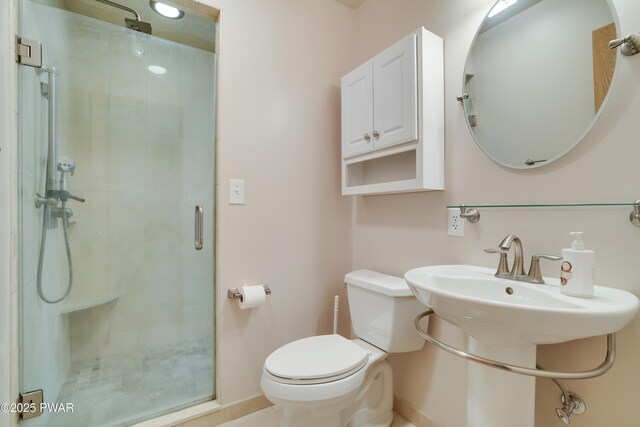 2766 Owego Tpke, Hawley, PA 18428 - bathroom with toilet, a shower stall, baseboards, and a sink