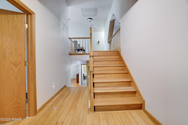 2766 Owego Tpke, Hawley, PA 18428 - stairway featuring hardwood / wood-style flooring and baseboards